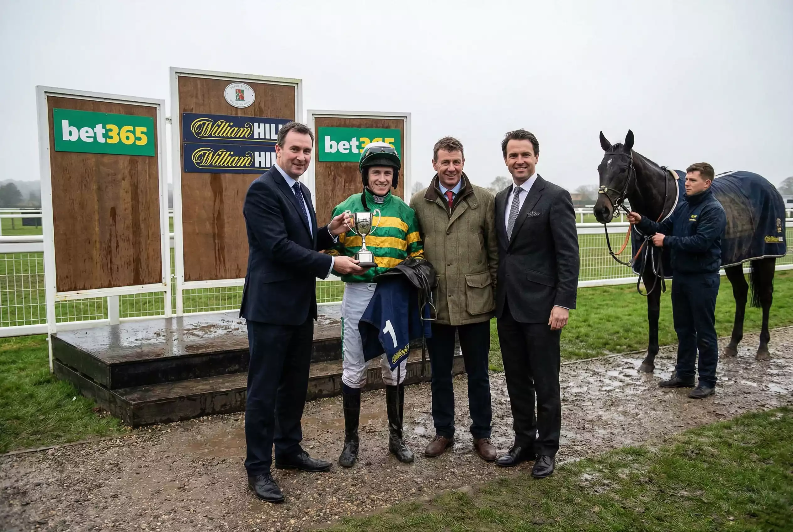 Presentation ceremony at a British racecourse with a trophy being awarded to winning connections
