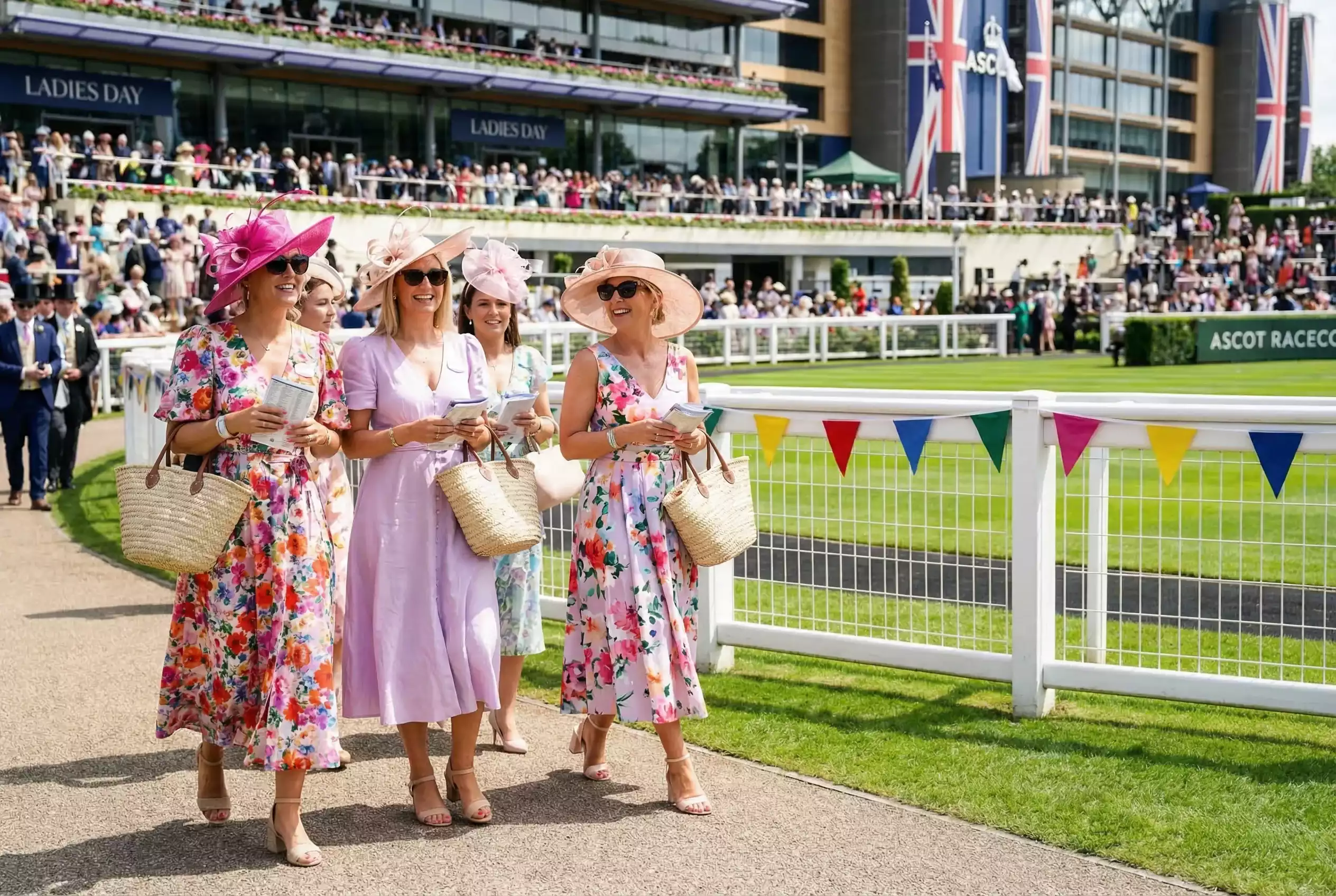 Racegoers dressed for Southwell Ladies Day with the racecourse in the background